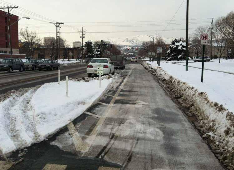 Protected cycletrack in Salt Lake City, UT after small truck plow snow removal.