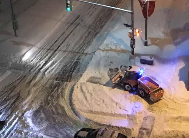 Sidewalk snow plow truck in Canada.