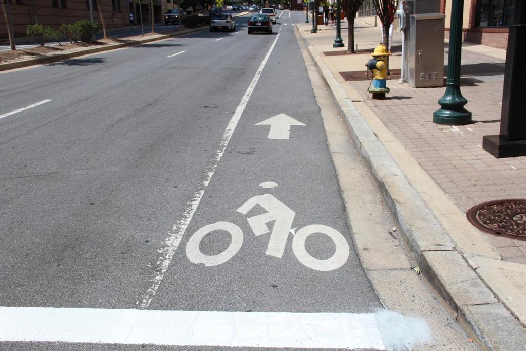 STANDARD BIKE LANE A portion of a roadway designated by striping, signing, and pavement markings for the preferential or exclusive use of bicycles, and on which through-travel by motor vehicles is
