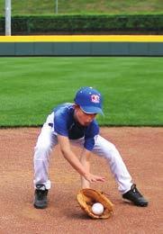 Players will field the ball out in front of their body with glove hand down and throwing hand on top