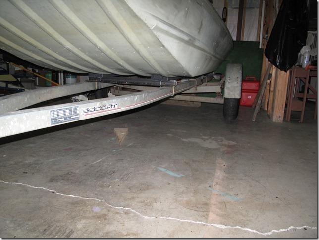 Above is a photo of the boat resting on the trailer and support (bunk) boards. I added pressure-treated side guide (bunk) boards, covered with the same carpet.