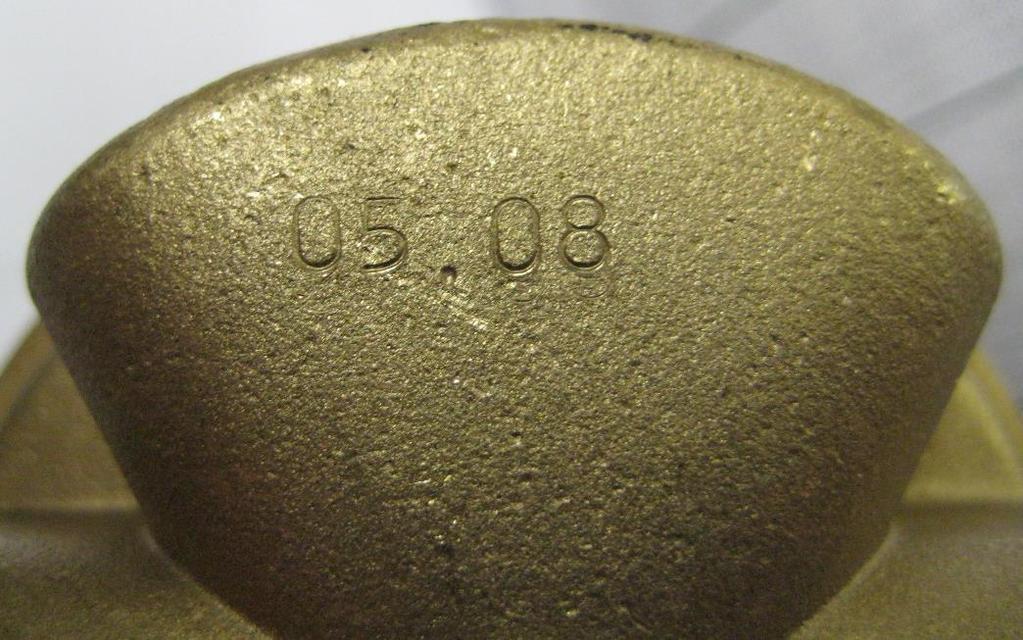 1 shows the stamping on a regulator, indicating the month and year of manufacture. Figure 2.