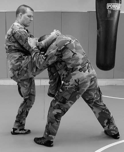 e. Knee Strike (Figure 6-14). A knee strike can be a devastating weapon. It is best used when in the clinch, at very close range, or when the enemy is against a wall.
