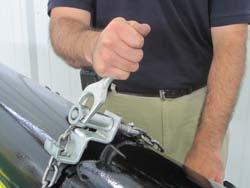 Make sure Hold down device chain is tightly secures load to vee. B.