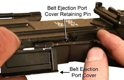 Insert the feed port cover retaining pin the rest of the way through until it is flush. Refer to Figure 17. Figure 17. Installing the Feed Port Cover. 6.