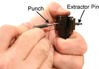 TM 8370-50107-IN/18 0011 00 4. While compressing the extractor, push out the extractor pin using a punch. Refer to Figure 4. Figure 4. Removing the Extractor Pin. 5.