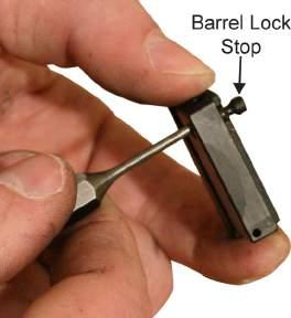 TM 8370-50107-IN/18 0012 00 2. Use a flathead screw driver to unscrew and remove the barrel lock adjustment screw from the barrel lock base. Refer to Figure 2.