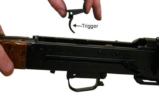Refer to Figure 15. Figure 15. Removing the Sear, Sear Spring, and Trigger. 16.
