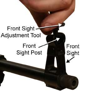 Refer to Figure 4. Figure 4. Removing the Flash Suppressor Locking Detent and Spring. 5.