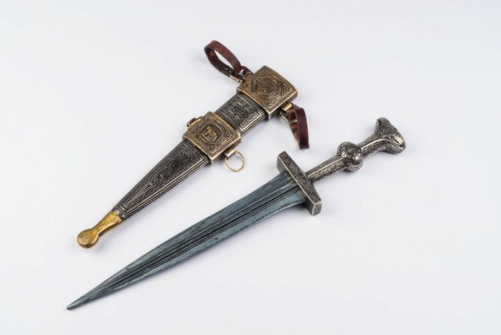INFORMATION DAGGER HANDLE UNDER ADULT SUPERVISION ONLY! This is a short dagger, or pugio in its case or scabbard, which was carried by legionaries.