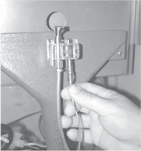 For Classic heaters, remove the screw(s) that secure the pilot assembly to the burner. See Fig.