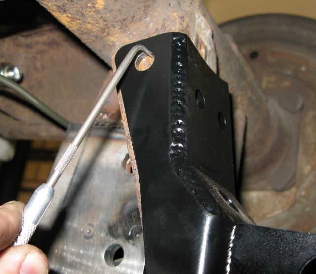 Use the 1/2-20 x 1-1/4 Socket Head Bolt and hardware to hold the bracket in place.