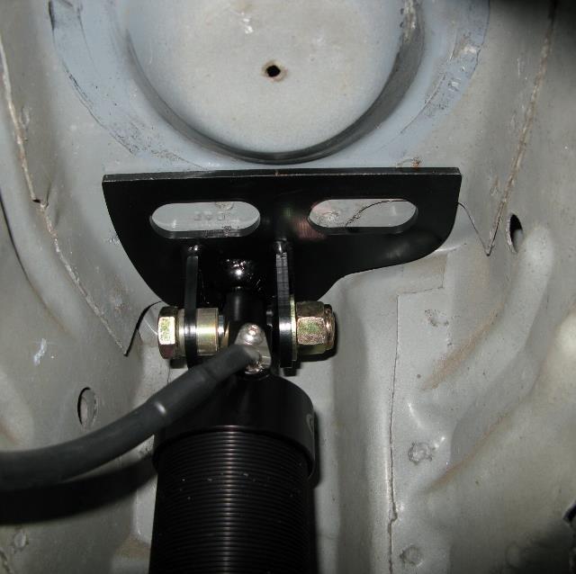 15. Determine the LH and RH upper coilover mount (Figure 1 and 2) and install the correct assembly into the vehicle.