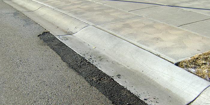 ensuring that the gutterto-pavement transition remains