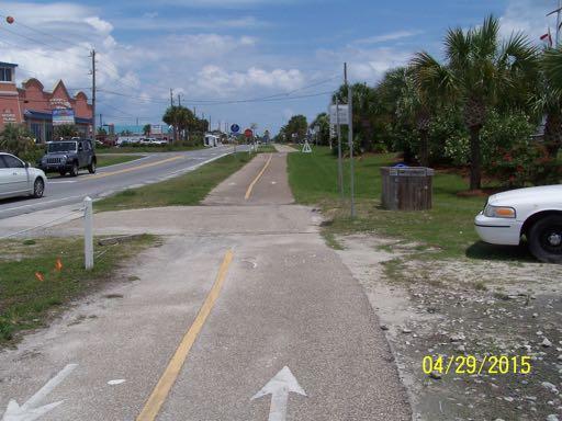 The path is 10 feet wide. There are no detectable warning surfaces on the path at intersections with streets.