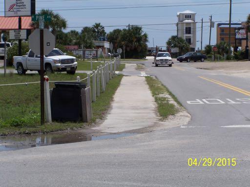 There is a concrete sidewalk on the northeast side of First Street West from West Pine Street to West Gulf Beach Drive, approximately 320 feet in length.