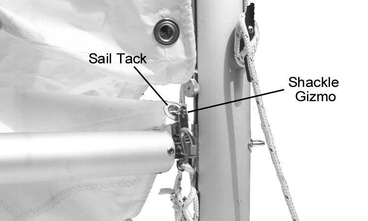 G. Installing the Main Sail: (1) Do these steps to install the main sail: (a) Attach the lower forward corner of the sail (the tack )