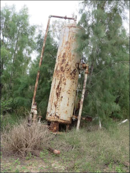 Figure 4. Abandoned oil treatment equipment in Lower Rio NWR.