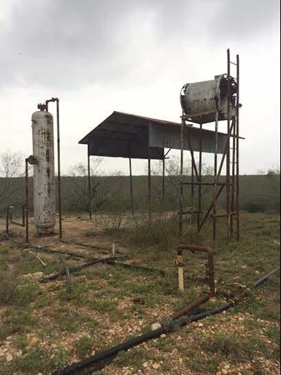Even when the owners of the structures can be identified, FWS seldom asked the owners to remove these structures. Figure 5. An abandoned well pad site.