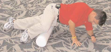Begin with both arms overhead and feet flat on the floor.