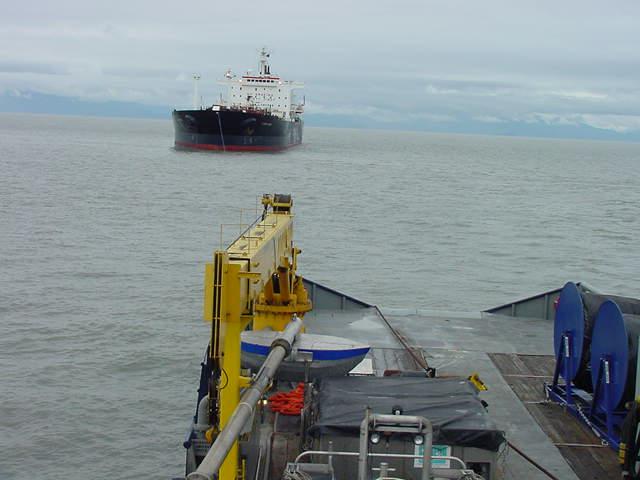 A Tank Ship is taken into tow by a OSV