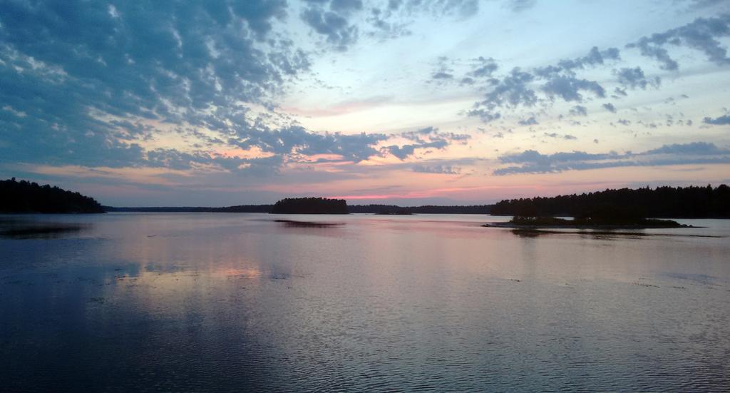The Swedish archipelago The light in the north achieve supree perfection, and each sunset, in one of the nuberless islands and coves of the Skarsgard, akes you forget the teperature of the water and