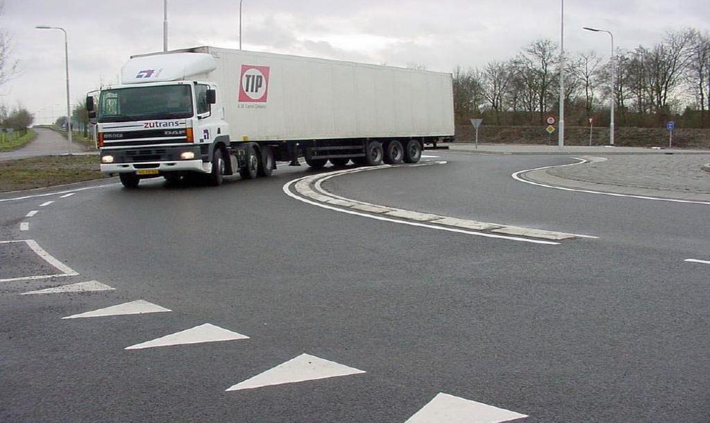 Figure 4. Turbo Roundabout Raised Lane Divider in the Netherlands (Fortuijn) As a result of the lane dividers, drivers need to choose the correct lane before they enter the roundabout.