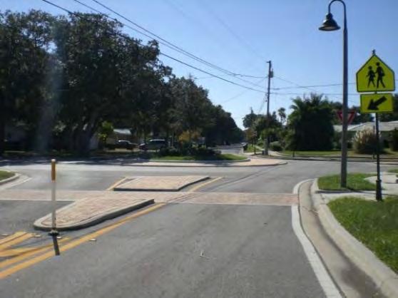 Crossing Islands Description: Provide raised pedestrian refuge islands in strategic locations of the street at intersections or midblock crossings to help protect crossing pedestrians from motor