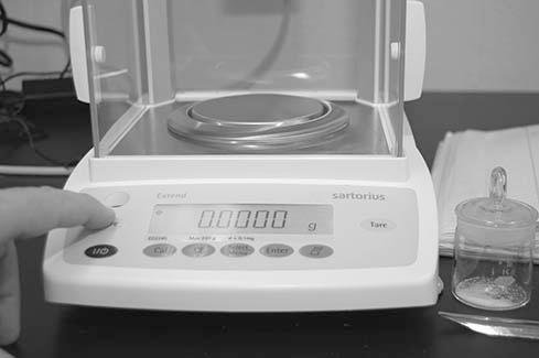 3. Check that the analytical balance is properly zeroed; press the tare bar if necessary (left image below) 4.