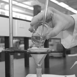 To perform a quantitative transfer: Make sure that the funnel is not sitting tightly in the neck of the flask there must be an air gap and that there is no danger of the flask falling over.