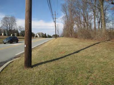 Utility poles Steep slopes and vegetation adjacent to the roadway Topography Airport Road is the
