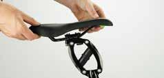 Whilst looking up at the base of the saddle, turn the screw