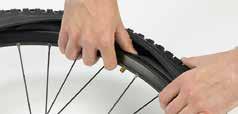 push the edge of the outer tyre under the wheel rim, all the