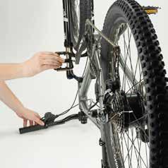 With the bike upside down, adjust the barrel adjuster by undoing it with a quarter turn at a time.
