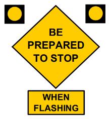 Flashing beacons and When Flashing plaques (W16-13P), shown in Figure 2.7, can be added to this sign to alert drivers that the green light is about to change to red in a few seconds (FHWA, 2009).