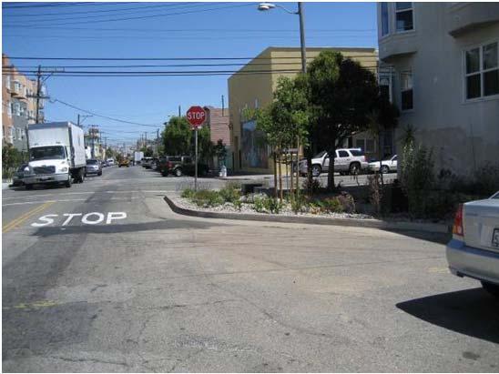 bulb-outs narrow the street by extending the curbs toward the center of the roadway or by building detached raised islands to allow for drainage.