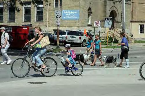 Example 6 Two female bicyclists; One child Four pedestrians One male;
