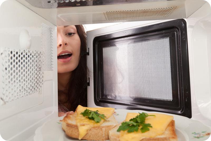 Did you ever wonder how a microwave works? It directs invisible waves of radiation toward the food placed inside of it. The radiation transfers energy to the food, causing it to get warmer.
