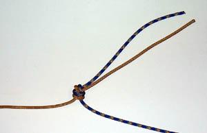 reported accidents when ropes where tied together with a figure-8 knot: that knot can flip over repeatedly until it rolls off the ends.
