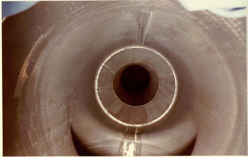 Calcine residue in the bottom of the 8-inch fluidizing air line Weld bead with calcine residue Figure B-6. View of the fluidizing air distribution plenum following the decontamination.