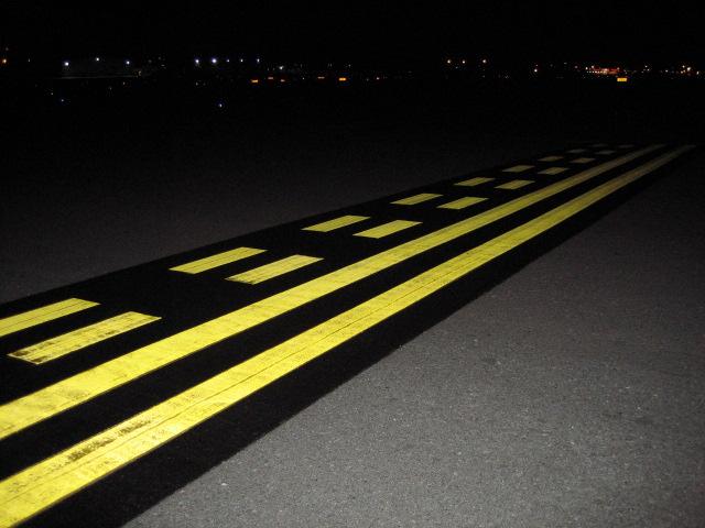 The glass beads in holding position markings must be evaluated at night.