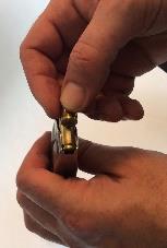 7. Unload the magazine by holding it with the bullet end of the cartridge pointed in safe direction, away from yourself and others. Press each cartridge forward and out of the magazine. (Figure 11.