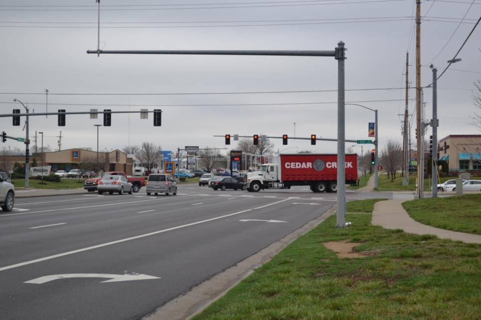 A ground view of the intersection is shown in figure 4.26 facing northbound. As shown, each lane has a signal head over it. Additionally, a raised median is located on all approaches.