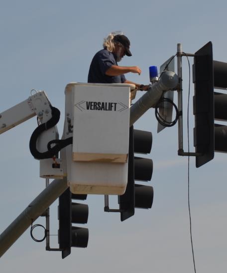 In this instance, it will be confusing for a police officer located downstream of an intersection to tell whether a violation occurred during the permitted phase or after the red signal indication.