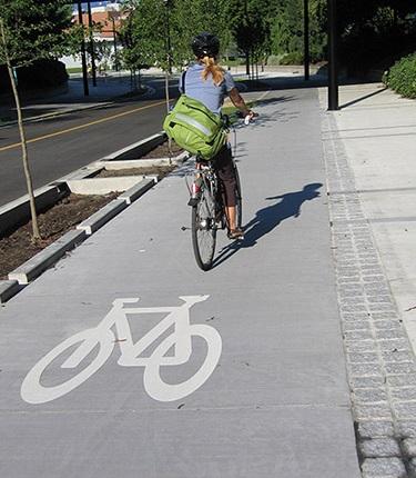 Separated Bike Lanes DESCRIPTION AKA cycle tracks bicycle facilities that run alongside a roadway separated from automobile traffic by a physical barrier PURPOSE Provide attractive facility for a