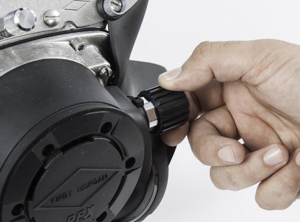 Once adjustment is achieved, securely tighten the inlet nipple jam nut against the regulator body. against the hex on the nipple tube by again using two 13/16 inch wrenches.