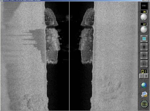 Sidescan View Shipwreck entering display Reflection of shipwreck Rocky area Port Side Starboard Side Figure 16 Sidescan view showing the same area as Figure 15, but