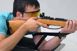must be made by shifting the left hand forward to lower the sights or rearward to raise the sights. Here is where a coach on assistant can help.