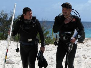 Enlarge Richard Harris/NPR Ramon deleon, left, and Mark Vermeij return from a dive to study the health of Bonaire's coral reef. But much to everybody's relief, the coral here didn't die off.