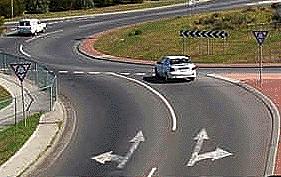 IN061 - Intersections When you wish to drive straight ahead at a roundabout you may enter from